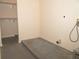Laundry area with concrete floor, shelving, and hookups at 608 Woodknoll Ct, Jonesboro, GA 30238