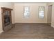 Spacious living room featuring hardwood floors and a stone fireplace at 608 Woodknoll Ct, Jonesboro, GA 30238