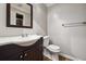 Clean bathroom with dark vanity and toilet at 747 Bethesda School Rd, Lawrenceville, GA 30044