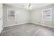 Spacious bedroom with grey laminate wood flooring and neutral walls at 747 Bethesda School Rd, Lawrenceville, GA 30044
