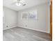 Bright bedroom featuring grey laminate floors and neutral walls at 747 Bethesda School Rd, Lawrenceville, GA 30044