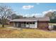 Brick ranch house with covered patio and storage shed at 747 Bethesda School Rd, Lawrenceville, GA 30044
