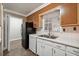 White kitchen cabinets and appliances, tile floor at 747 Bethesda School Rd, Lawrenceville, GA 30044