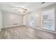 Spacious living room with hardwood floors and multiple windows at 747 Bethesda School Rd, Lawrenceville, GA 30044