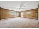 Spacious living room with wood paneling and carpeted floors at 747 Bethesda School Rd, Lawrenceville, GA 30044