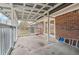 Covered patio with brick wall and concrete flooring at 747 Bethesda School Rd, Lawrenceville, GA 30044