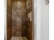 Stand up shower with dark brown tile at 747 Bethesda School Rd, Lawrenceville, GA 30044