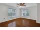 Bright bedroom with hardwood floors and two windows at 3655 Habersham Ne Rd # B-254, Atlanta, GA 30305