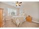 Comfortable bedroom with plush carpeting, and large window offering natural light at 224 Orchards Cir, Woodstock, GA 30188