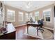 Home office with hardwood floors and large windows at 224 Orchards Cir, Woodstock, GA 30188