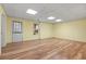 Finished basement featuring vinyl flooring, recessed lighting and door to outside at 4125 Crowder Nw Dr, Kennesaw, GA 30152