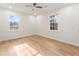 Well-lit bedroom with hardwood floors and a ceiling fan at 2360 Beaver Creek Se Rd, Smyrna, GA 30080