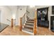 Elegant staircase with wood railing and built-in shelving at 2482 Crescent Park Ct, Atlanta, GA 30339