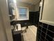 Bathroom with black and white tile at 2893 Heather Dr, Atlanta, GA 30344