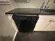 Kitchen features black dishwasher and dark countertop at 2893 Heather Dr, Atlanta, GA 30344