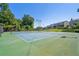 Two well-maintained tennis courts in a residential community at 3050 Centerglen Ln, Cumming, GA 30040