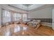 Main bedroom with hardwood floors and large windows at 3365 Preservation Cir, Lilburn, GA 30047