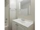 Simple bathroom with a white vanity and a shower at 1962 Pine Oak Sw Dr, Atlanta, GA 30310