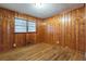 Bedroom with hardwood floors and wood paneling at 1962 Pine Oak Sw Dr, Atlanta, GA 30310