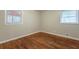 Simple bedroom with hardwood floors and neutral walls at 1962 Pine Oak Sw Dr, Atlanta, GA 30310