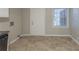 Kitchen with white cabinets, black appliances, and tile floor at 1962 Pine Oak Sw Dr, Atlanta, GA 30310