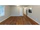 Living room with hardwood floors and view to kitchen at 1962 Pine Oak Sw Dr, Atlanta, GA 30310