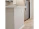 Kitchen island with white countertop and cabinets at 12027 Harbour Town Pkwy, Fayetteville, GA 30215