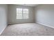 Bright bedroom featuring neutral walls and carpeted floors at 1215 Catalina Pkwy, Mcdonough, GA 30252