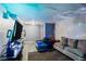 Finished basement with a couch, TV, and a bed at 1279 Kenilworth Sw Dr, Atlanta, GA 30310