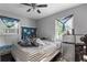 Bedroom with striped bedding and a window air conditioner at 1279 Kenilworth Sw Dr, Atlanta, GA 30310