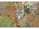 Aerial view showcasing home's back deck and surrounding trees at 4325 Sprucebough Dr, Marietta, GA 30062