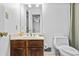 Simple bathroom with wood vanity and a toilet at 4325 Sprucebough Dr, Marietta, GA 30062