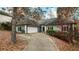 House exterior view with a long driveway and fall foliage at 4325 Sprucebough Dr, Marietta, GA 30062