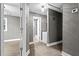 Hallway with light grey walls and wood-look floors at 2436 Clarissa Nw Dr, Atlanta, GA 30318