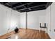 Unfinished basement room with laminate flooring at 1496 Meadowlark Dr, Decatur, GA 30032