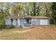 Gray house with a small front porch and yard at 1496 Meadowlark Dr, Decatur, GA 30032