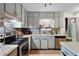 Updated kitchen features stainless steel appliances and granite countertops at 1496 Meadowlark Dr, Decatur, GA 30032