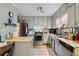 Bright eat-in kitchen with stainless steel appliances and ample cabinetry at 1496 Meadowlark Dr, Decatur, GA 30032