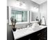 Modern bathroom with double vanity and white framed mirrors at 406 Illinois Nw Ave, Atlanta, GA 30314