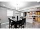 Bright dining area with modern light fixture and kitchen view at 406 Illinois Nw Ave, Atlanta, GA 30314