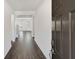 Bright entryway with dark brown front door and hardwood floors at 514 Nolden Trl, Dacula, GA 30019