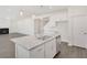 Kitchen island with granite countertop and double sink, open to living area at 514 Nolden Trl, Dacula, GA 30019