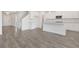Open living room with hardwood flooring and kitchen island view at 514 Nolden Trl, Dacula, GA 30019