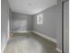 Simple basement room with gray walls and wood-look flooring at 1321 Mcclelland Ave, Atlanta, GA 30344