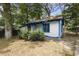Charming white house with blue accents, a covered porch, and a small yard at 1321 Mcclelland Ave, Atlanta, GA 30344