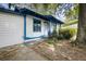 White house with blue trim, showcasing a side view and walkway at 1321 Mcclelland Ave, Atlanta, GA 30344