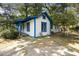 White house with blue accents, showcasing a corner view at 1321 Mcclelland Ave, Atlanta, GA 30344