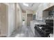 Open kitchen with white cabinets, gray flooring and skylights at 1321 Mcclelland Ave, Atlanta, GA 30344