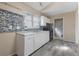 Kitchen with white cabinets, mosaic backsplash and a gas range at 1321 Mcclelland Ave, Atlanta, GA 30344
