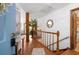 Welcoming entryway with hardwood floors, a wooden staircase, and decorative accents at 2447 Lakeshore Ne Dr, Conyers, GA 30012